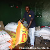  &ndash; James acquiring rice to deliver to those in need. June 14, 2007 (James Mansaray, photographer)