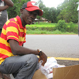  &ndash; James Mansaray on the road to Kabala. He stopped to visit with those along the way and to give them supplies. © NHA, J Mansaray 2007
