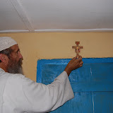  &ndash; Fr. Seraphim placing Cross given by Archbishop Morse, Blessed in Assisi for the Kabala School. ..© 2008 September Nazareth House Apostolate Media, James B. Mansaray, photographer.