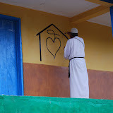  &ndash; Fr. Seraphim paints NHA Logo/Trade Mark on the Kabala School Building...© 2008 September Nazareth House Apostolate Media, James B. Mansaray, photographer.