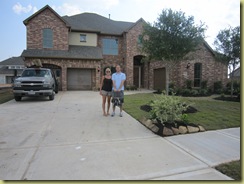 Kelly, Isla and Jordan in front of the house (5.29.2010)