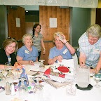 Helene holds up Auction money.  Roy Ellen is still adding.   Paula and Virginia Melton assist.