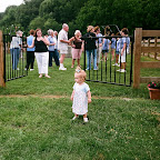 Whitney Leigh Philpott escapes the fence as mother looks on.