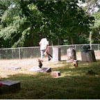 Click to Expand George Wilkerson blows grass from his gandparents graves at Gleaves- Clement Cemetery, Hermitage, Tennessee June 2009