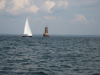 NA 13 Resolute sailing off of Bloody Point Lighthouse in the Bay