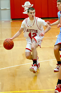 Senior Tyler Breidenbach <br>drives against LCC