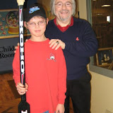 Carl Beane and Boy Holding Famous Hockey Player's Stick