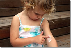 child-with-eczema-applying-lotion