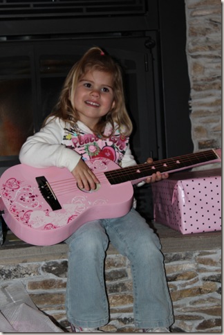 Reagan playing her guitar