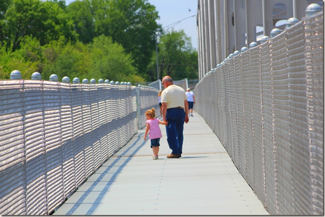 Jim and Reagan walking across the bridge