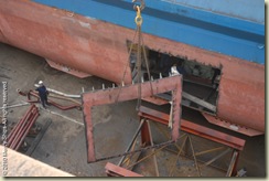 AFM Port side hole welded and cut  to remove the engines. The metal piece being removed and craned up to the dock for removal to the SAShipyard.