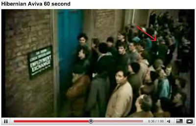 screenshot from youtube video with arrow drawn pointing at indistinct figure that could be anyone towards the rear of a dole queue