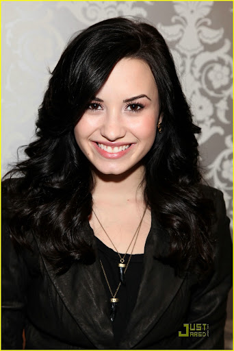 BEVERLY HILLS, CA - JANUARY 16: Actress Demi Lovato poses with the L'Oreal display during the HBO Luxury Lounge in honor of the 67th annual Golden Globe Awards held at the Four Seasons Hotel on January 16, 2010 in Beverly Hills, California. (Photo by Angela Weiss/Getty Images for mediaplacement)