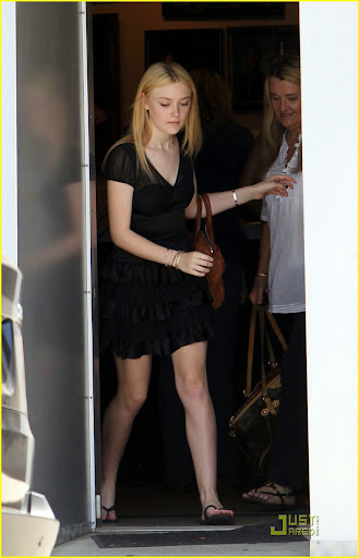 41808, NORTH HOLLYWOOD, CALIFORNIA - Monday June 21, 2010. **EXCLUSIVE** Dakota Fanning, one of the stars of the upcoming "Twilight Saga: Eclipse" seen leaving a photoshoot in North Hollywood wearing a black dress and flip flops. Photograph: Juan Sharma, PacificCoastNews.com**FEE MUST BE AGREED PRIOR TO USAGE** **E-TABLET/IPAD & MOBILE PHONE APP PUBLISHING REQUIRES ADDITIONAL FEES** UK OFFICE:+44 131 557 7760/7761 US OFFICE:1 310 261 9676