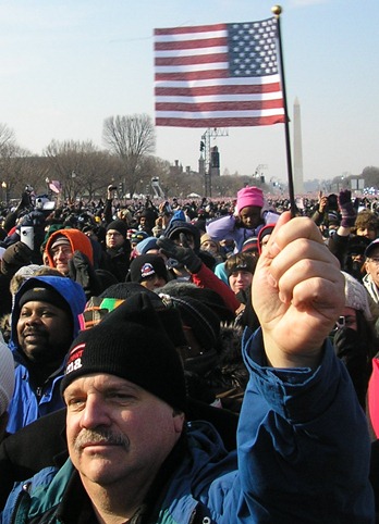 Man holding flag at Obama inauguration, 2009