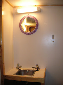 Sink with hot and cold running water in each cabin.