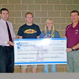 Marion County Bank's Steve Kraayenbrink with Pella Christian High School Principal Darryl De Ruiter and students Seth Fopma and Shelby Weaver