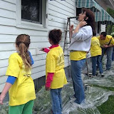 ACTS volunteers work on a painting project