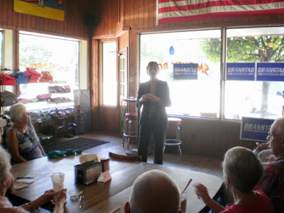 Kim Reynolds speaks to interested residents at a campaign stop in Pella