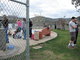 Believe it or not, there's a softball game going on behind me. The two folks on the right are watching a couple extra players (short, four legged ones) helping out in left field.