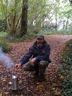 Feeding the flames, and looking forward to some hot tea.