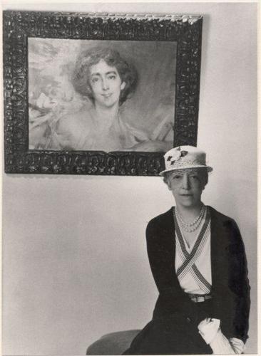 Lady Mendl (Elsie de Wolfe) with a portrait of her by Boldini, 1933.jpg