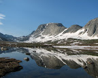 A calm lake makes for a beautiful reflection in the winds.