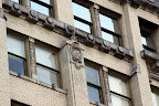 Edwardian features such as this crest and “scale-like” separations between windows.