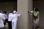Tourgoers feel the worked concrete of the Illinois State Bar Association buiding.