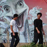 Erlian is the dinosaur capital  of China. I guess these guys  are used to dinos peering  down on them.
