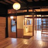shojiko.-high-village-house.-livingroom.-entrance-and-kitchen.-.jpg