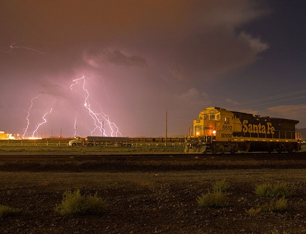 Thunderstorm seen while a rail engine passes through just east of the downtown Kingman area, in Arizona, USA 