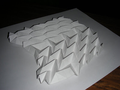 Collapsed compound v-shaped origami accordion
