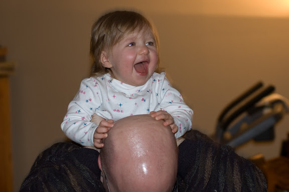 She loves being bounced on Daddy's shoulders.