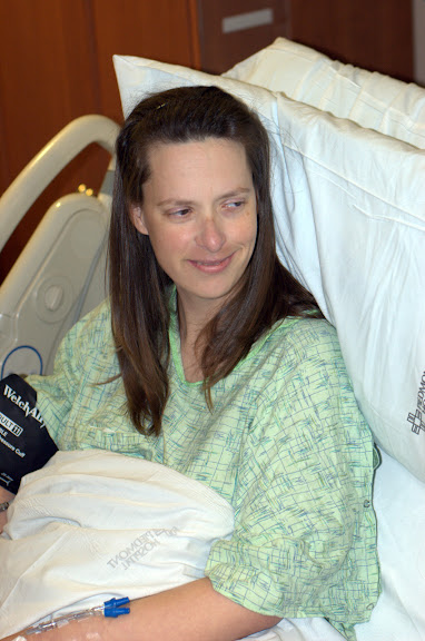 Sandra watching the nurses clean Sam up...