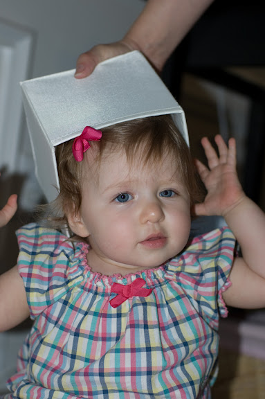 isn't quite sure about boxes on her head.