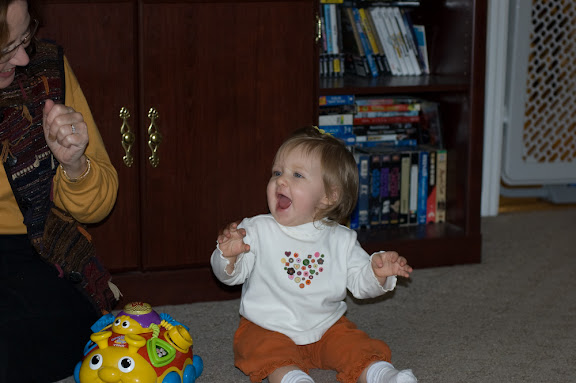 playing and laughing with her new toy from Aunt Sandy.