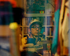 This dude seems a bit suspicious just because a huge lens is being pointed in his general direction.