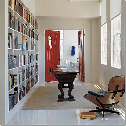 elle decor bookcase in hallway