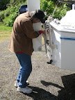 Jim works on securing S.K.'s rudder