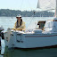 Jim at Dares helm is happy to be on the water today!