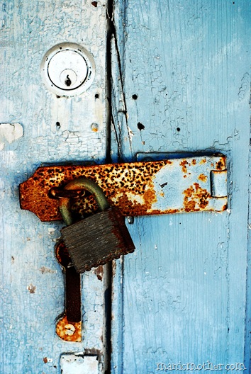 blue door with rusty lock