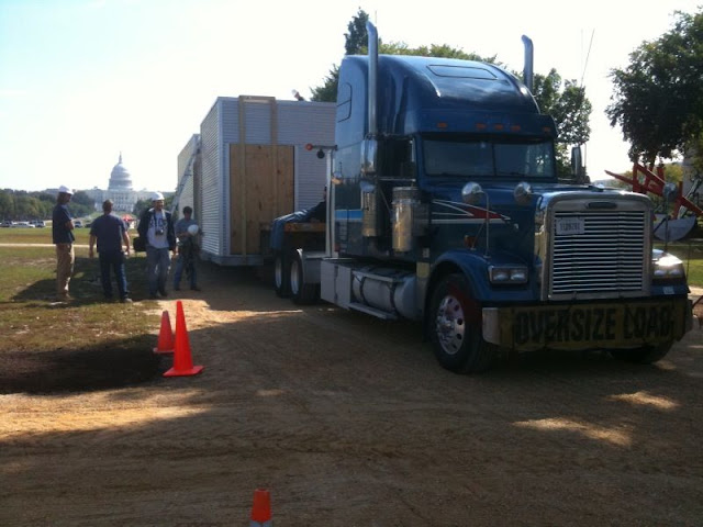 The ZEROW HOUSE on our 18 wheeler is currently waiting in line to be placed on the Mall via crane.