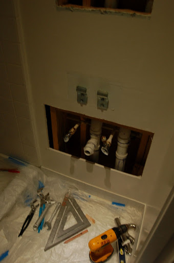 Fixing our plumbing leak.