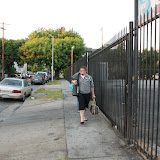 Spencer leads the march from the car, which is parked on some urine soaked corner :-/