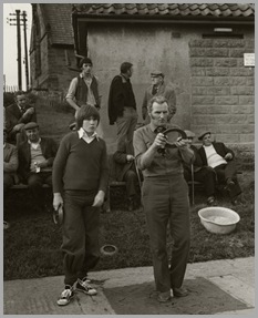 Father and son, Andrew and John White at Fylingthorpe Open North of England Championship on June 9th, 1979.Mr. White beat Andrew this game to go onto the semi-final against George Hutton of the Fylingthorpe Club.Andrew will have led off and put a ringer on.  Mr. White is attempting to top the ringer by throwing a flat quoit.
