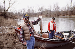 America The Beautiful - If you enjoy fly-fishing for steelhead [who wouldn't], southern Oregon's Rogue River is a great place to limber up your rod. Here I am (Jim Petersen) on an overcast morning in the early spring sometime in the early 1990s. I rarely keep fish, but on this day I wanted to bake on for dinner. That's Rick Miranda behind me - beyond doubt one of the best guides on the river and a spectacular fly-tier. Who would ever guess that Mr. Miranda is also one of the most skilled loggers in southern Oregon. I am sorry to say that I lost track of him nearly a decade ago.