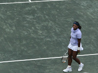Serena warms up in her lavender jumper