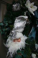 Christmas Wreath: I found the 60 - 70% cast-offs @ Michael's and came up with this lovely piece, mixing the blues, whites, and tarnished silvers into a fun wreath for the front door.