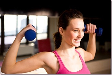 woman-wearing-pink-lifting-weights